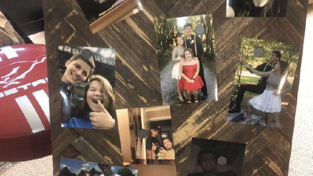 ey hold pictures up.  